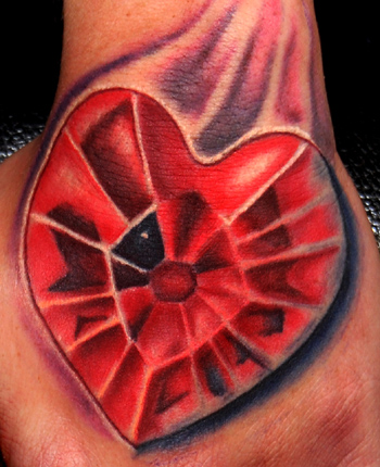 Trent Edwards - heart shaped ruby on hand